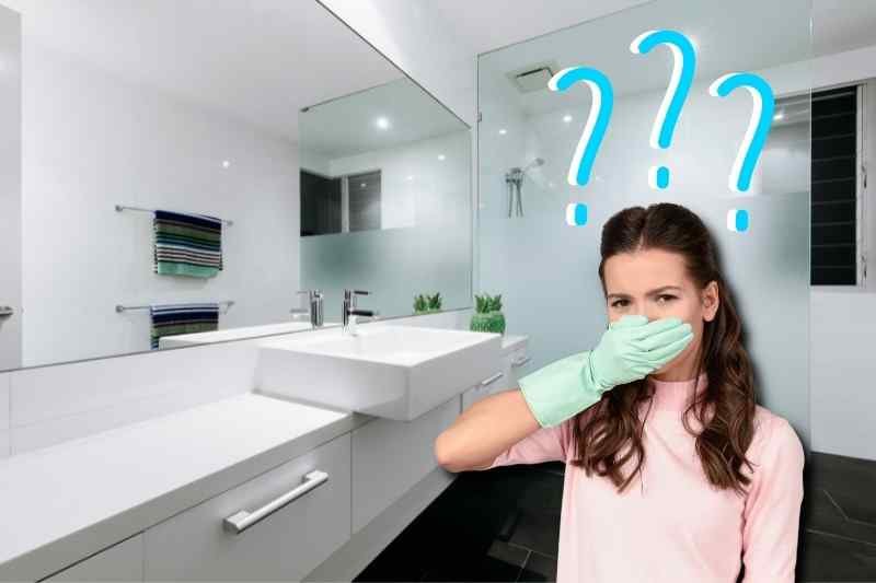 Cleaning a bathroom to remove lingering odors